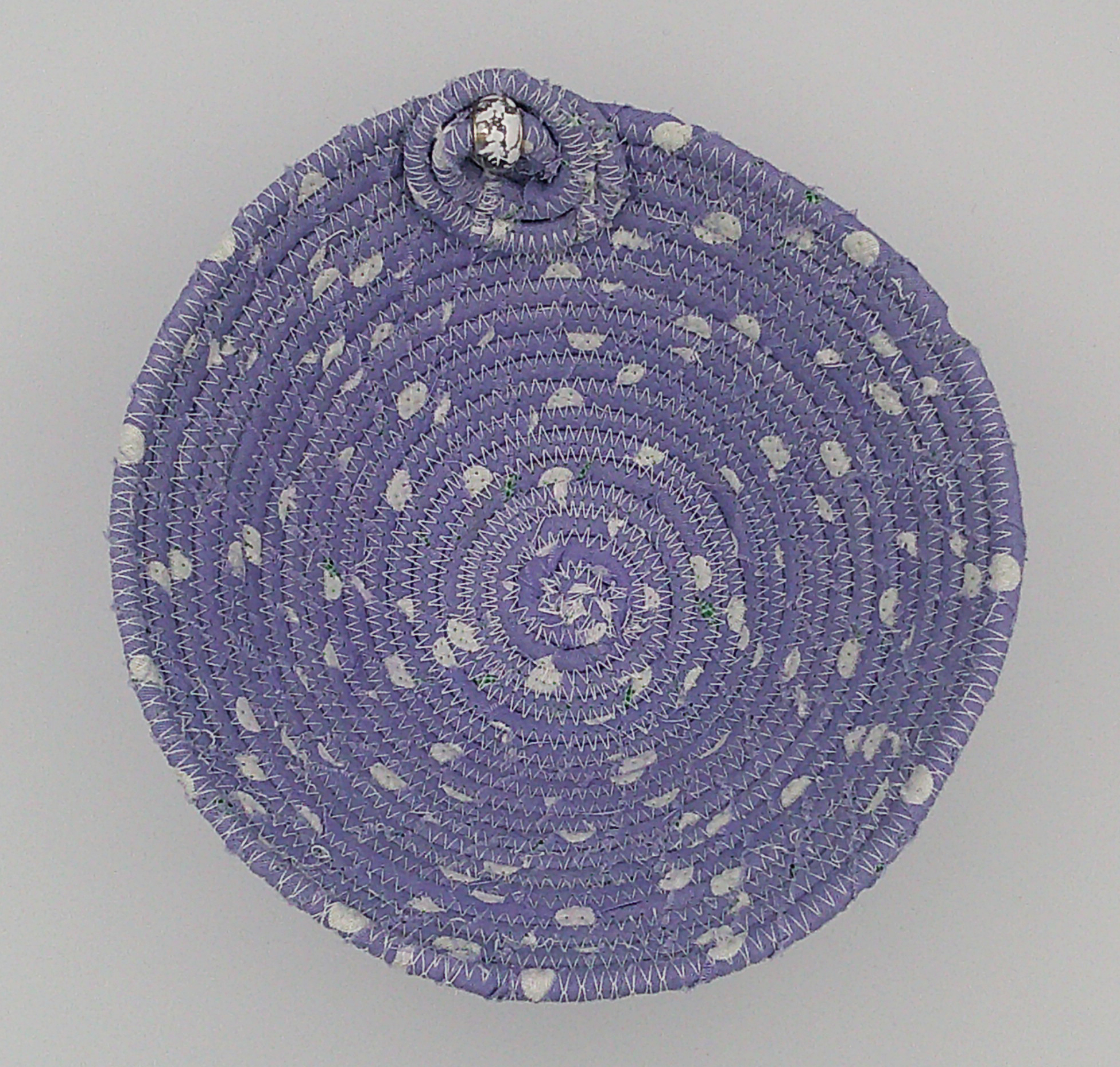 This view is looking directly down to the bottom of the bowl. It shows the embellishment on the inside of the bowl. This view is looking directly down to the bottom of the bowl. It shows the embellishment on the inside of the bowl.